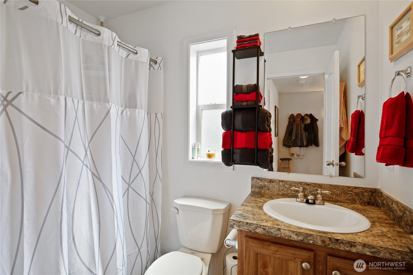 270 Romerman Road, Unit 34 Chehalis, WA 98532 - Photo 23 of 34 a bathroom with a sink vanity mirror and tub