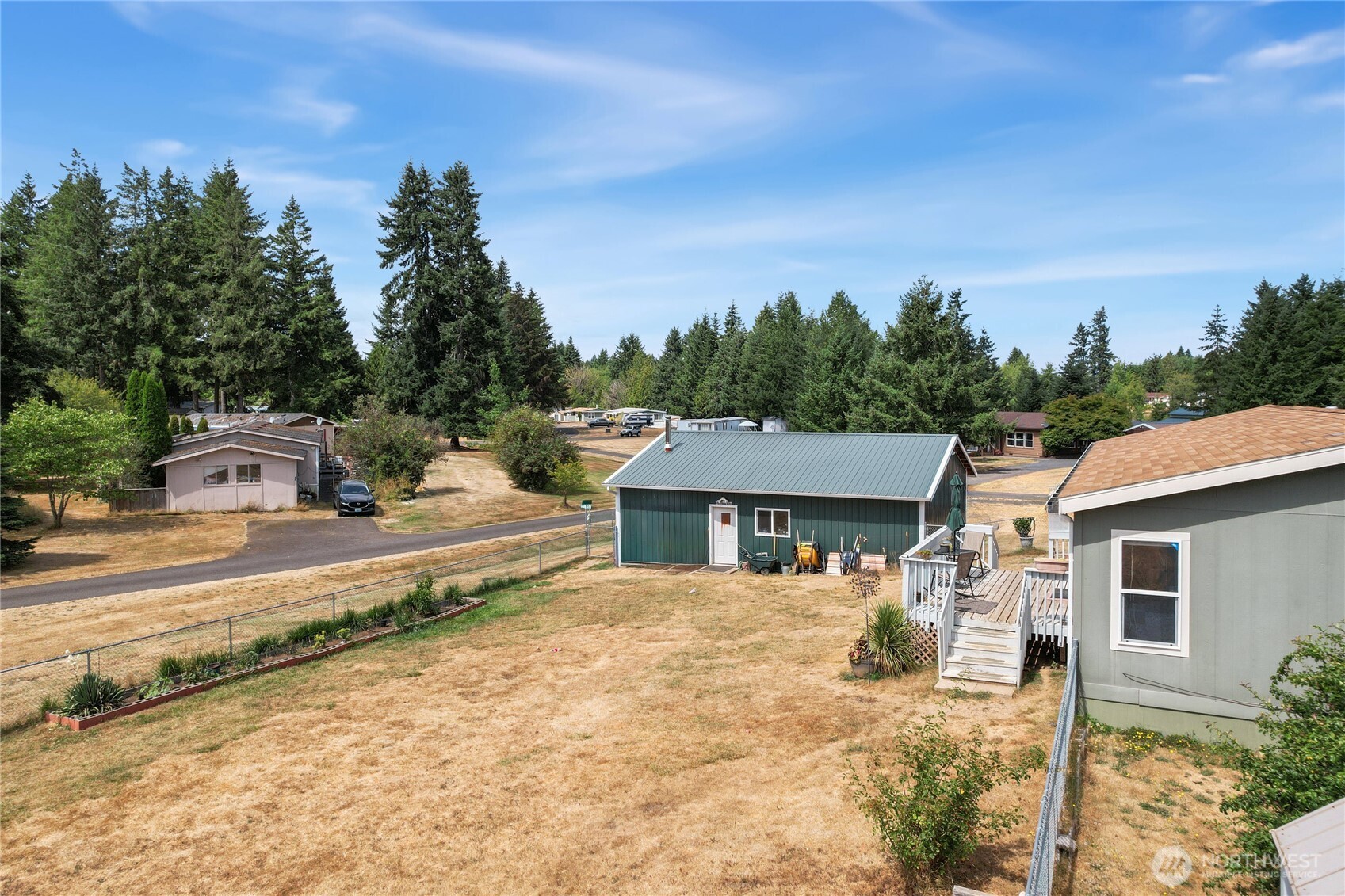 270 Romerman Road, Unit 34 Chehalis, WA 98532 - Photo 30 of 34 a front view of a house with a yard and garage