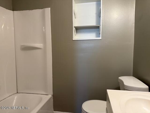 310 Noel Road Orange Park, FL 32073 - Photo 6 of 14 a white toilet sitting next to a bathroom sink