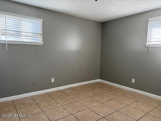 310 Noel Road Orange Park, FL 32073 - Photo 8 of 14 an empty room with windows