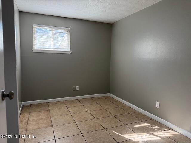 310 Noel Road Orange Park, FL 32073 - Photo 9 of 14 wooden floor in an empty room with a window