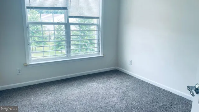 a view of staircase with white walls