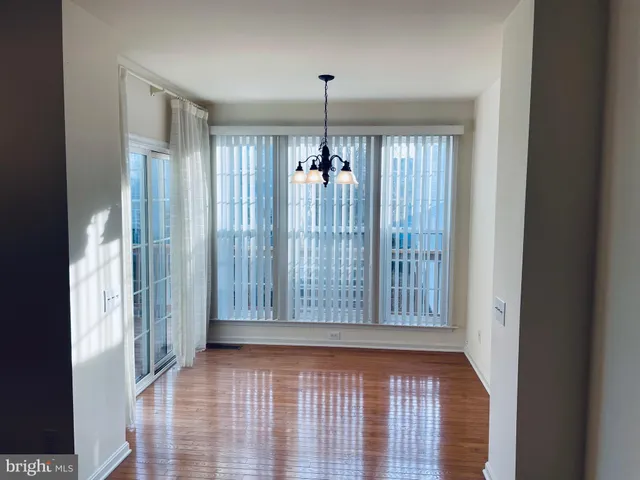 a view of a balcony with wooden floor