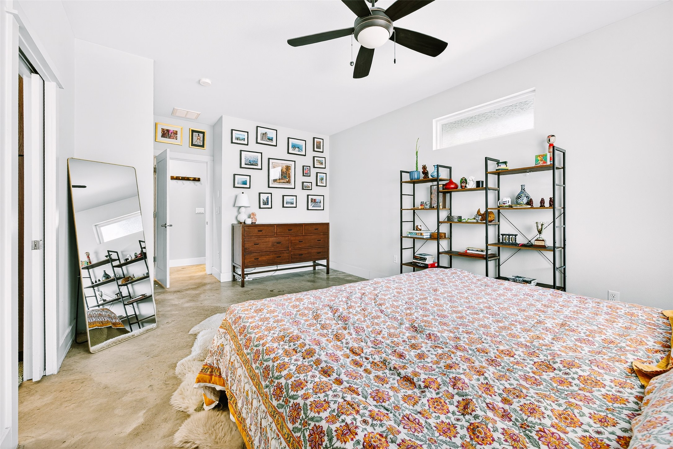 4917 Sunset Trail, Unit A Austin, TX 78745 - Photo 17 of 35 Bedroom with a ceiling fan and concrete flooring