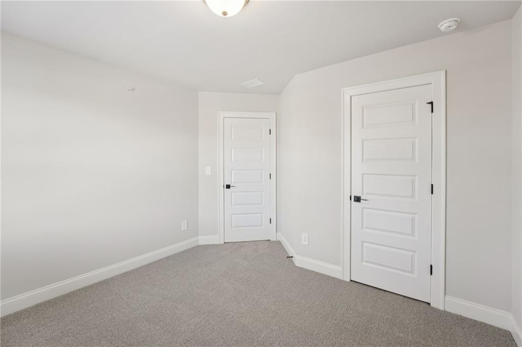 6440 Pinin Place Cumming, GA 30041 - Photo 35 of 52 a view of an empty room