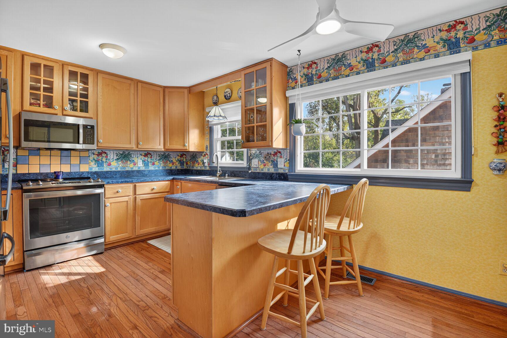 109 Aberdeen Road Rockville, MD 20850 - Photo 13 of 30 a kitchen with stainless steel appliances granite countertop a stove a sink and a microwave