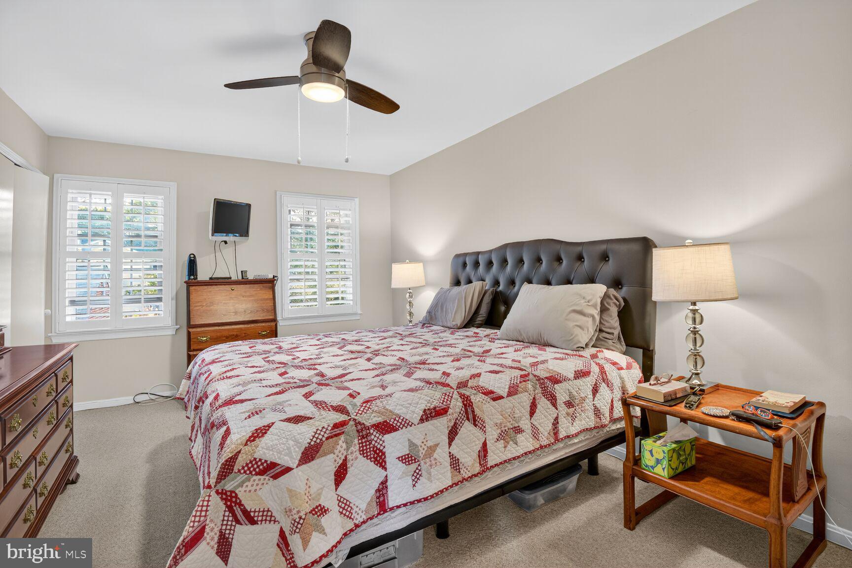 109 Aberdeen Road Rockville, MD 20850 - Photo 17 of 30 a bedroom with a bed and a chandelier