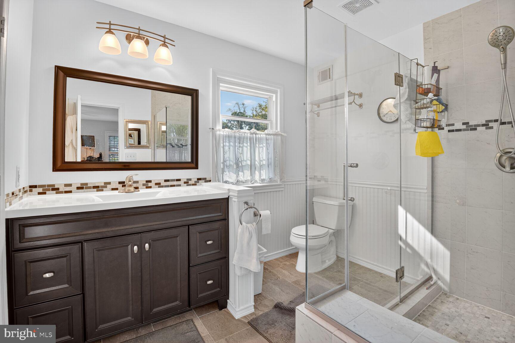 109 Aberdeen Road Rockville, MD 20850 - Photo 18 of 30 a bathroom with a granite countertop sink mirror and toilet