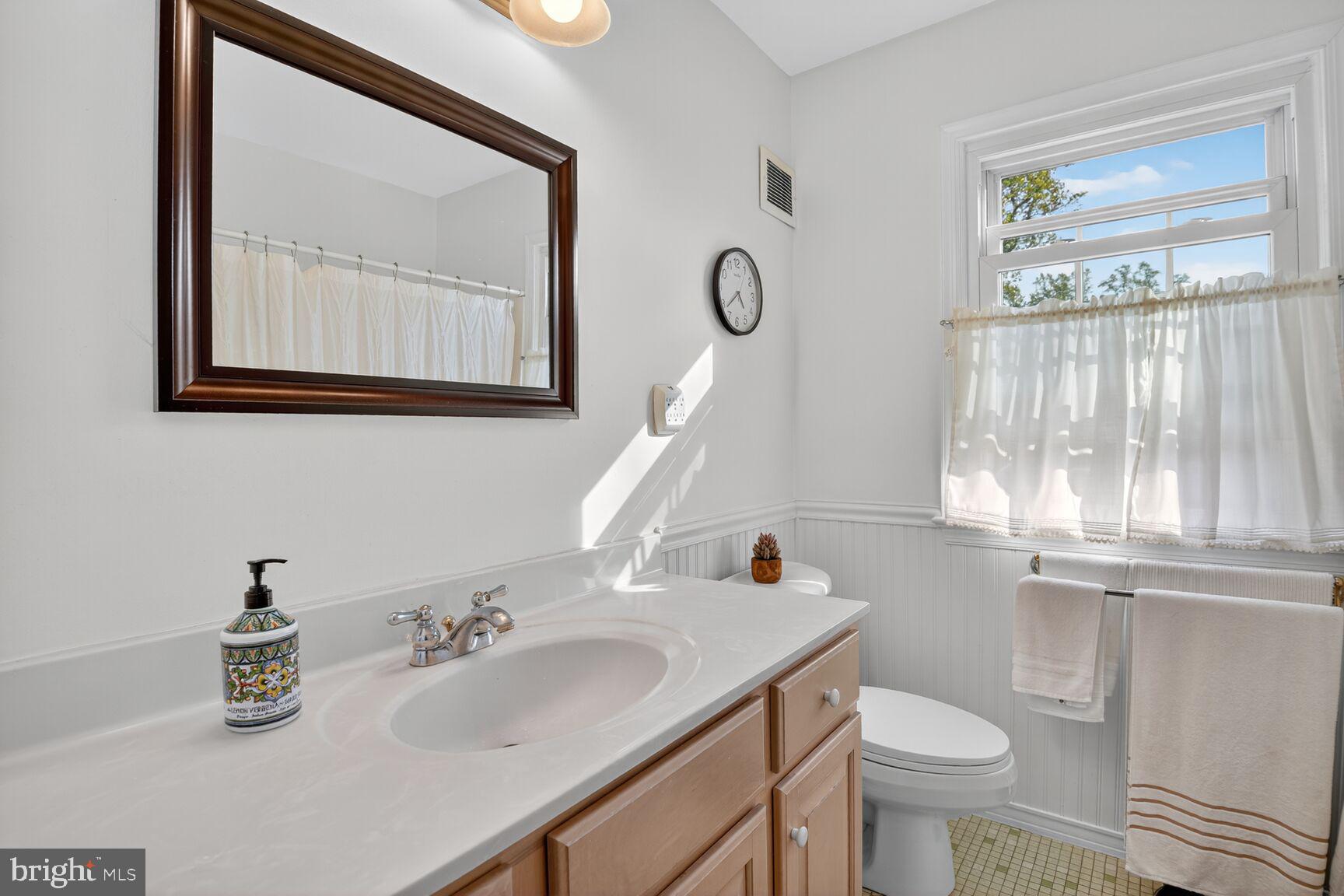 109 Aberdeen Road Rockville, MD 20850 - Photo 22 of 30 a bathroom with a sink and a mirror
