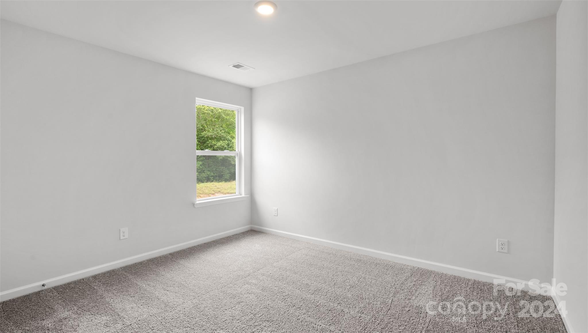 61 Callie River Clyde, NC 28721 - Photo 12 of 23 a view of an empty room with a window