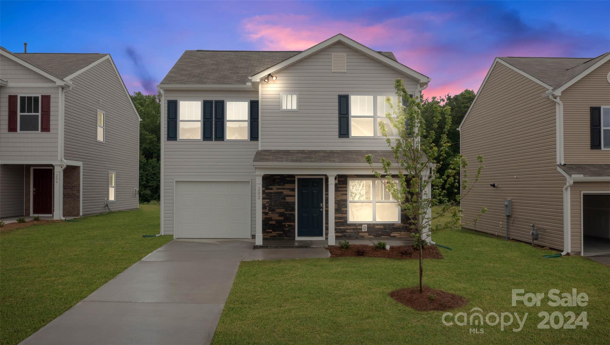 61 Callie River Clyde, NC 28721 - Photo 2 of 23 a front view of a house with garden
