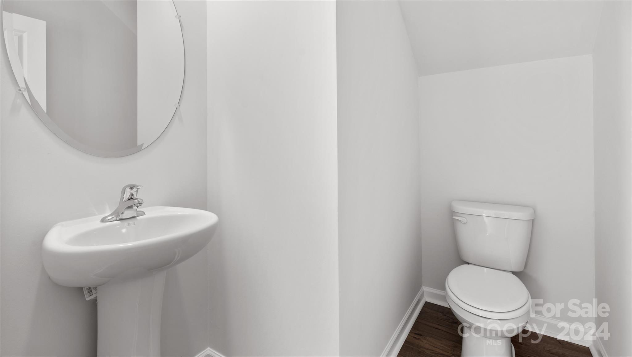 61 Callie River Clyde, NC 28721 - Photo 9 of 23 a bathroom with a sink toilet and a mirror