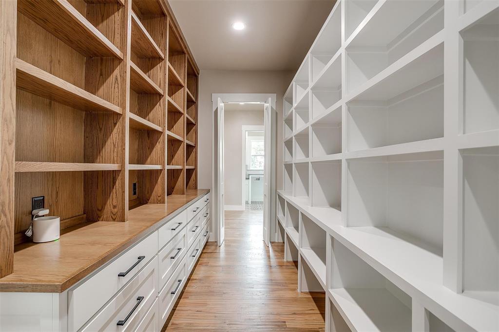 3019 Orchard Road Bowie, TX 76230 - Photo 18 of 40 a hallway with cabinets and wooden floor