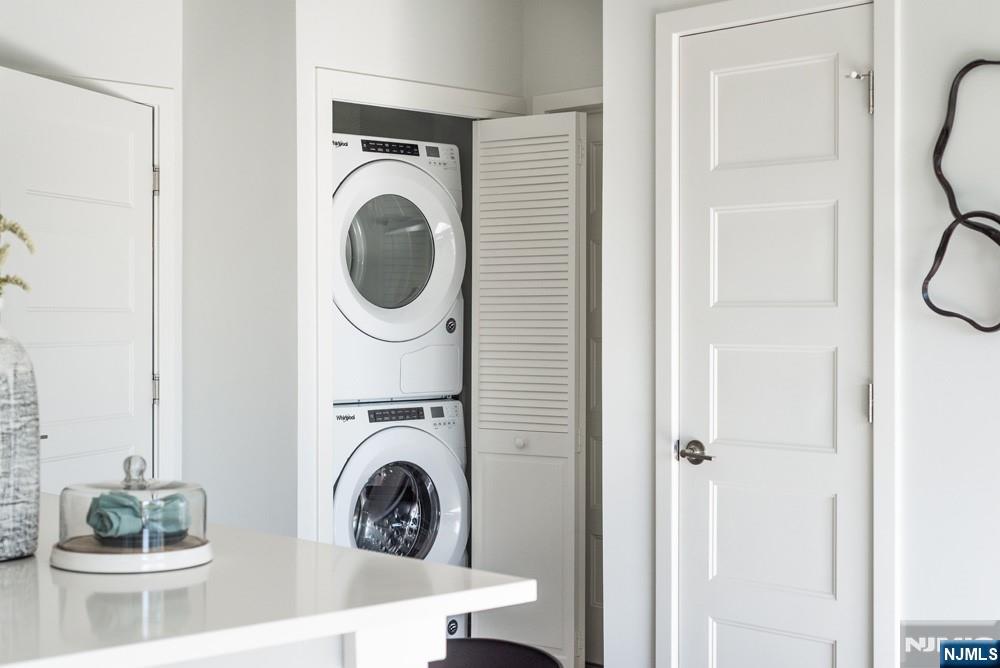 15 West Johnson Avenue, Unit 304 Bergenfield, NJ 07621 - Photo 14 of 15 a utility room with sink dryer and washer