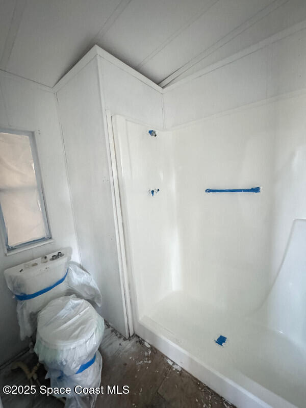 1973 Mango Street Northeast Palm Bay, FL 32905 - Photo 11 of 14 a bathroom with a toilet and a shower
