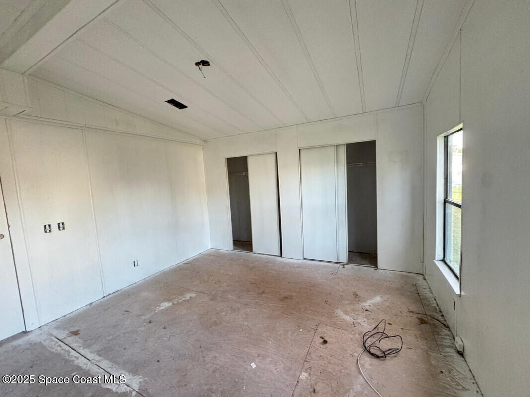 1973 Mango Street Northeast Palm Bay, FL 32905 - Photo 10 of 14 a view of a big room with closet and windows