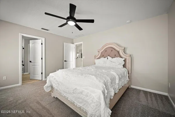 a bedroom with a bed and a closet