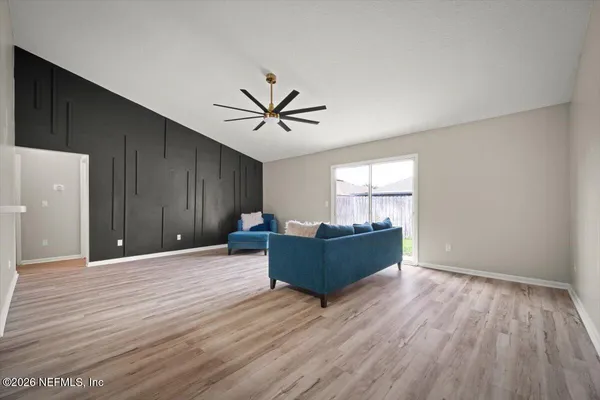 a living room with furniture and window