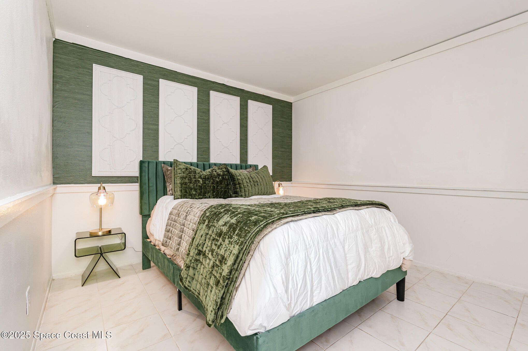 1411 Sheafe Avenue Northeast, Unit 101 Palm Bay, FL 32905 - Photo 14 of 25 a bedroom with a bed and a window