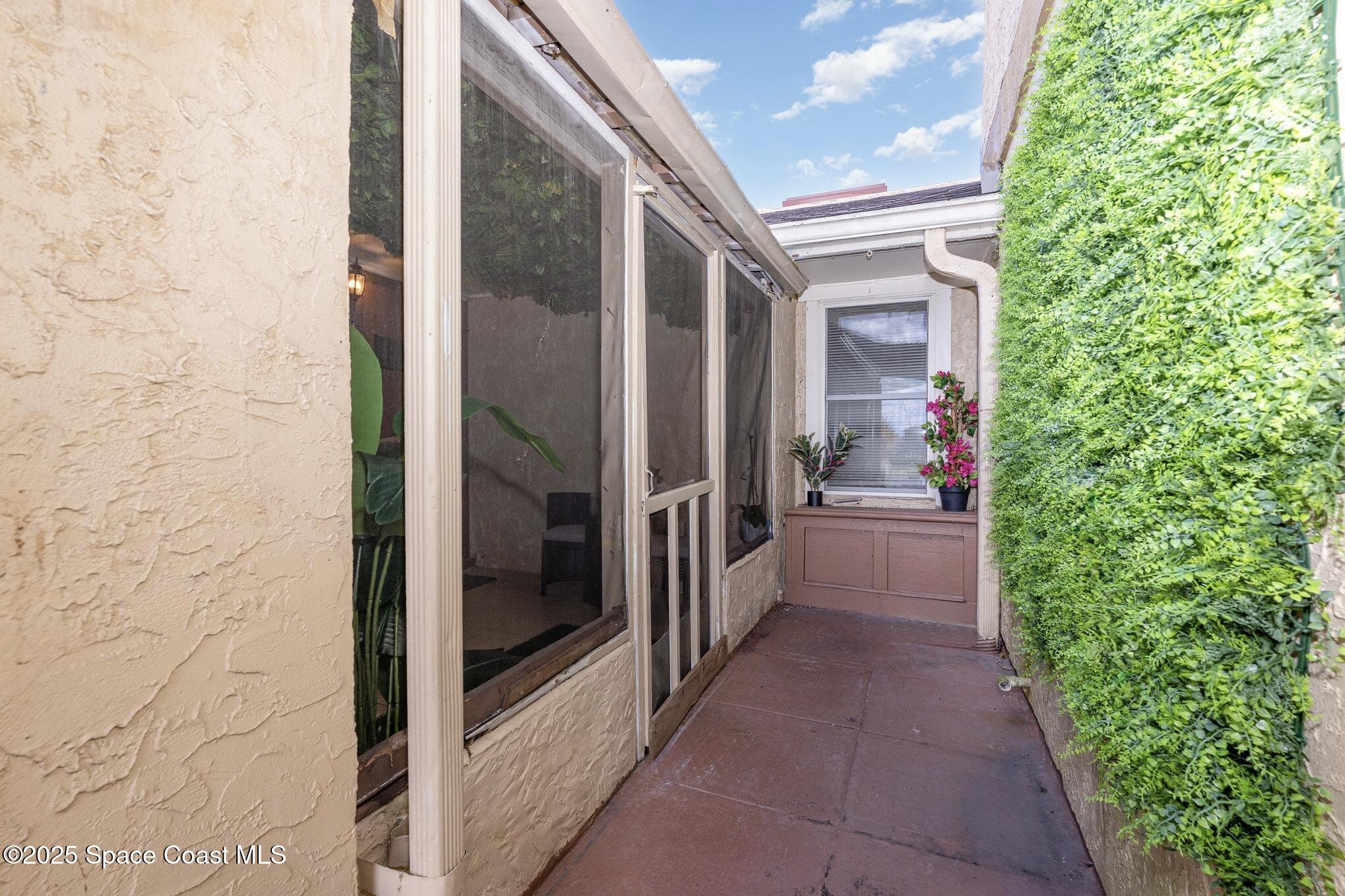 1411 Sheafe Avenue Northeast, Unit 101 Palm Bay, FL 32905 - Photo 16 of 25 a view of a corridor