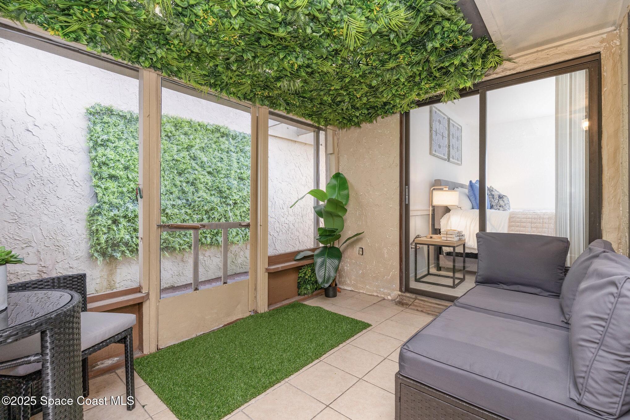 1411 Sheafe Avenue Northeast, Unit 101 Palm Bay, FL 32905 - Photo 18 of 25 a garden view with a seating space