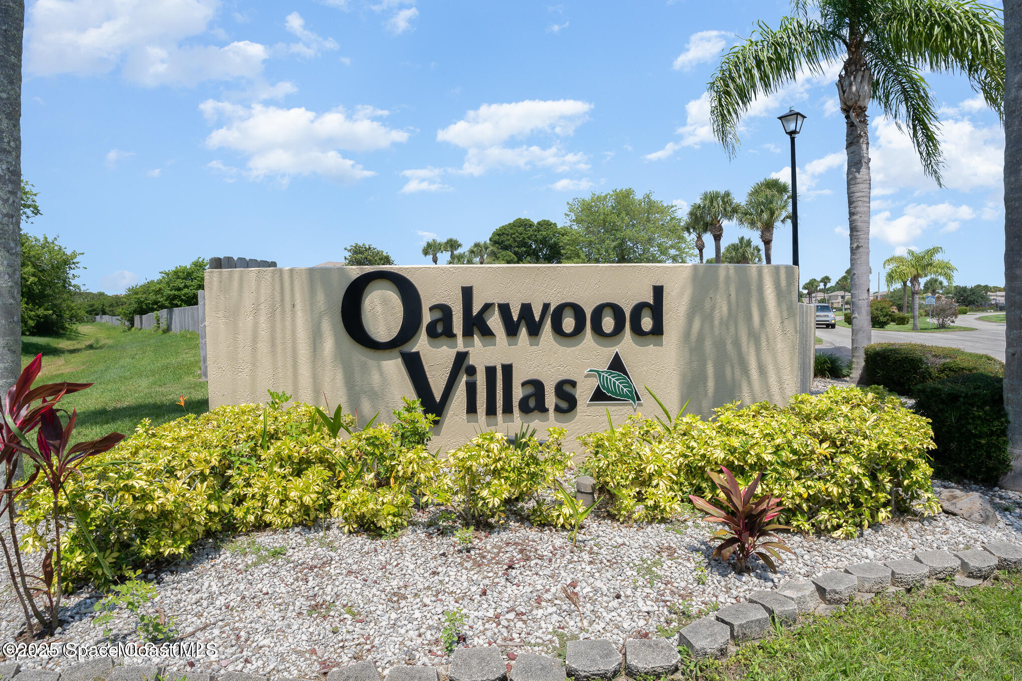 1411 Sheafe Avenue Northeast, Unit 101 Palm Bay, FL 32905 - Photo 20 of 25 a sign on the side of the road