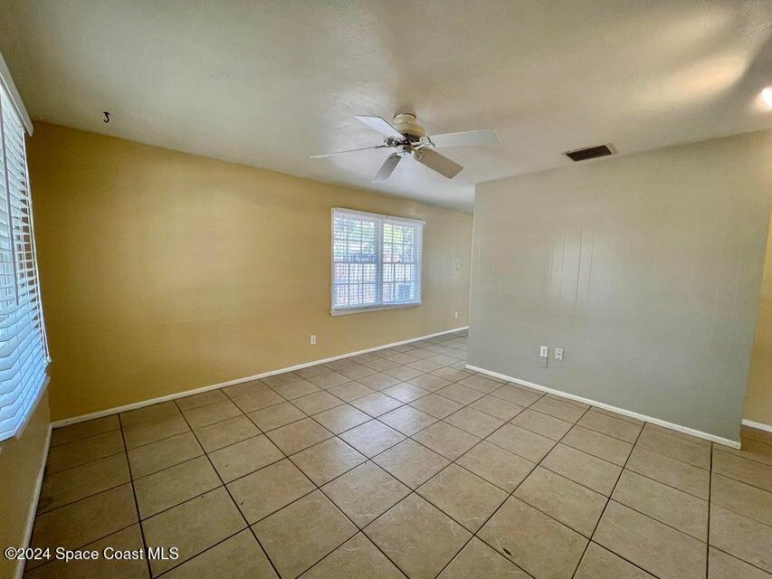 58 Shady Lane Rockledge, FL 32955 - Photo 2 of 12 an empty room with windows