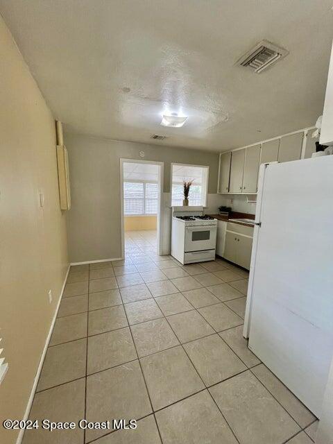 58 Shady Lane Rockledge, FL 32955 - Photo 4 of 12 a kitchen with a sink a stove and cabinets