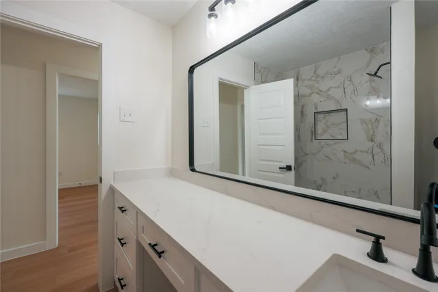 a bathroom with a bathtub and a sink
