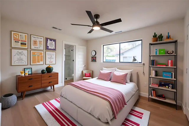 a bedroom with a bed cabinets and window