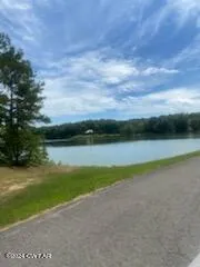 a view of a stadium that has a big playing ground