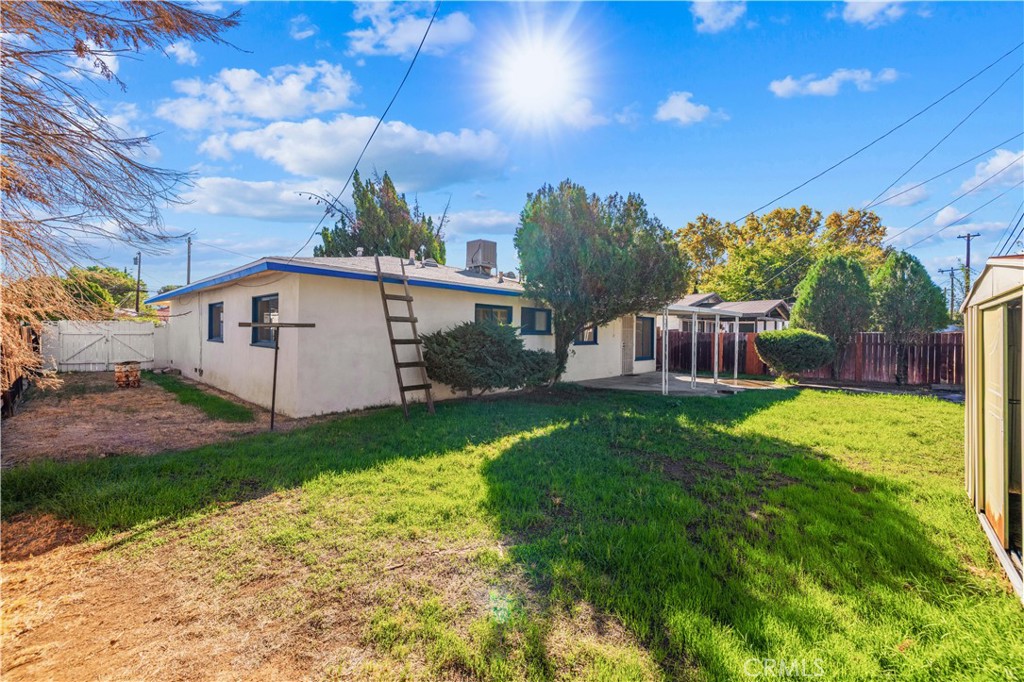 45443 Saigon Avenue Lancaster, CA 93534 - Photo 18 of 20 a view of a house with backyard and sitting area
