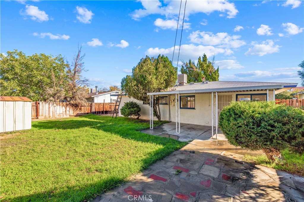 45443 Saigon Avenue Lancaster, CA 93534 - Photo 19 of 20 a front view of a house with garden