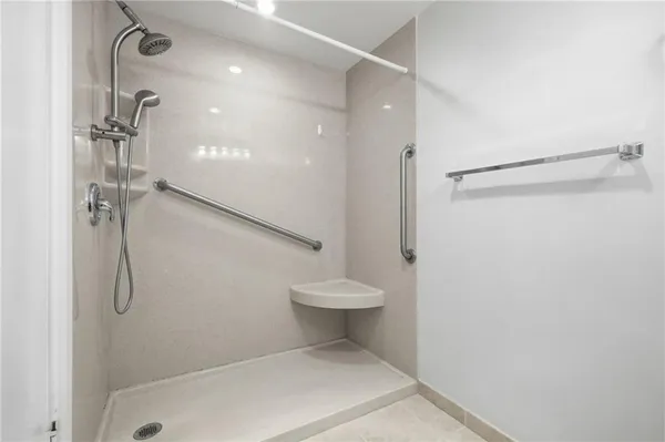 a bathroom with a shower and a toilet