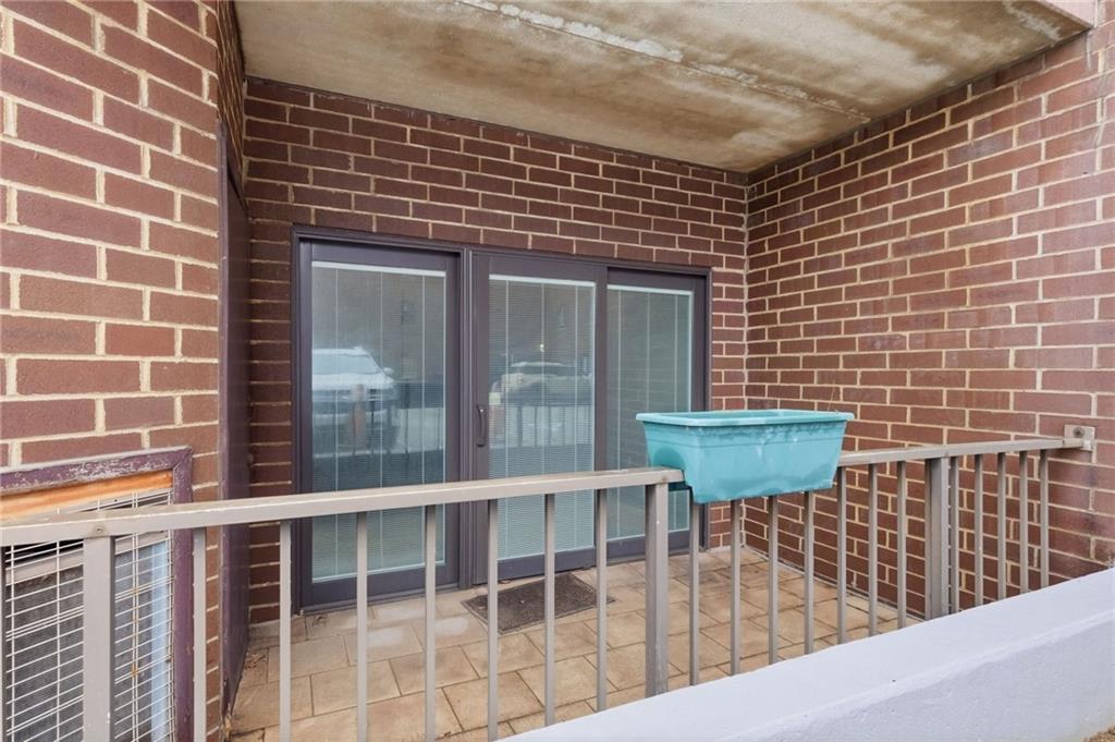 5600 Munhall Road, Unit 202 Pittsburgh, PA 15217 - Photo 20 of 24 a view of a brick house with a window
