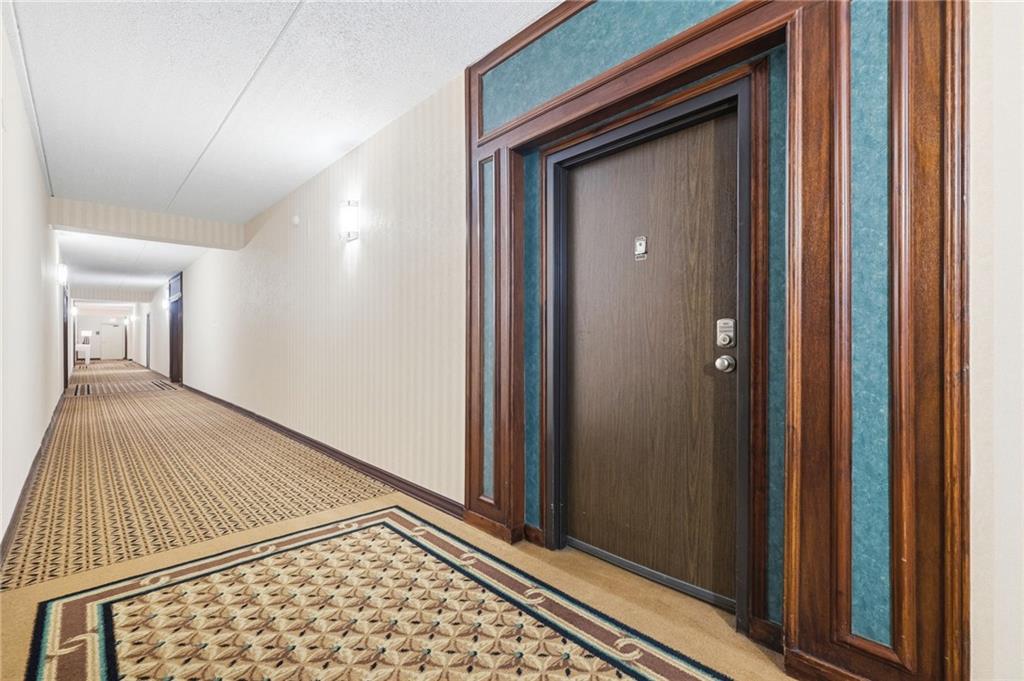 5600 Munhall Road, Unit 202 Pittsburgh, PA 15217 - Photo 3 of 24 a view of a bedroom from a hallway