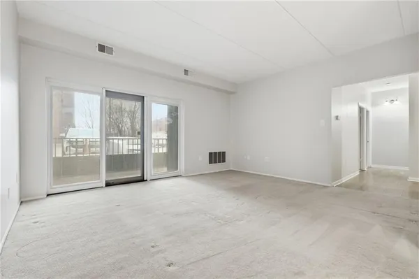 an empty room with windows