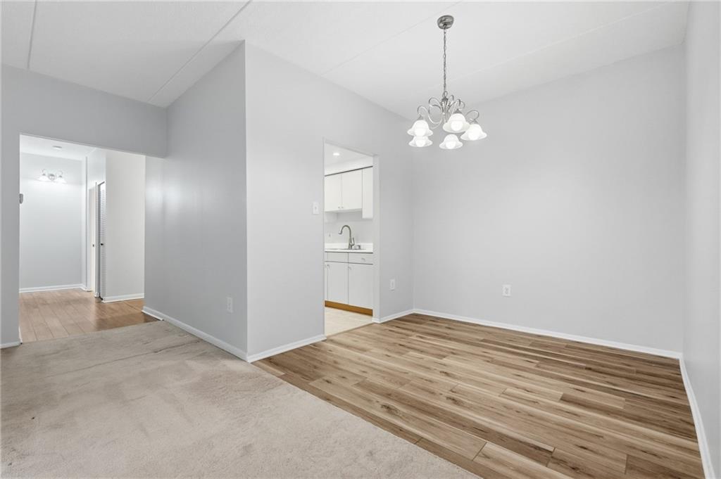 5600 Munhall Road, Unit 202 Pittsburgh, PA 15217 - Photo 6 of 24 a view of an empty room with chandelier fan