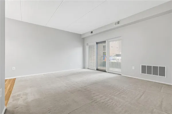 a view of an empty room with a window