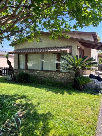 a house view with a garden space