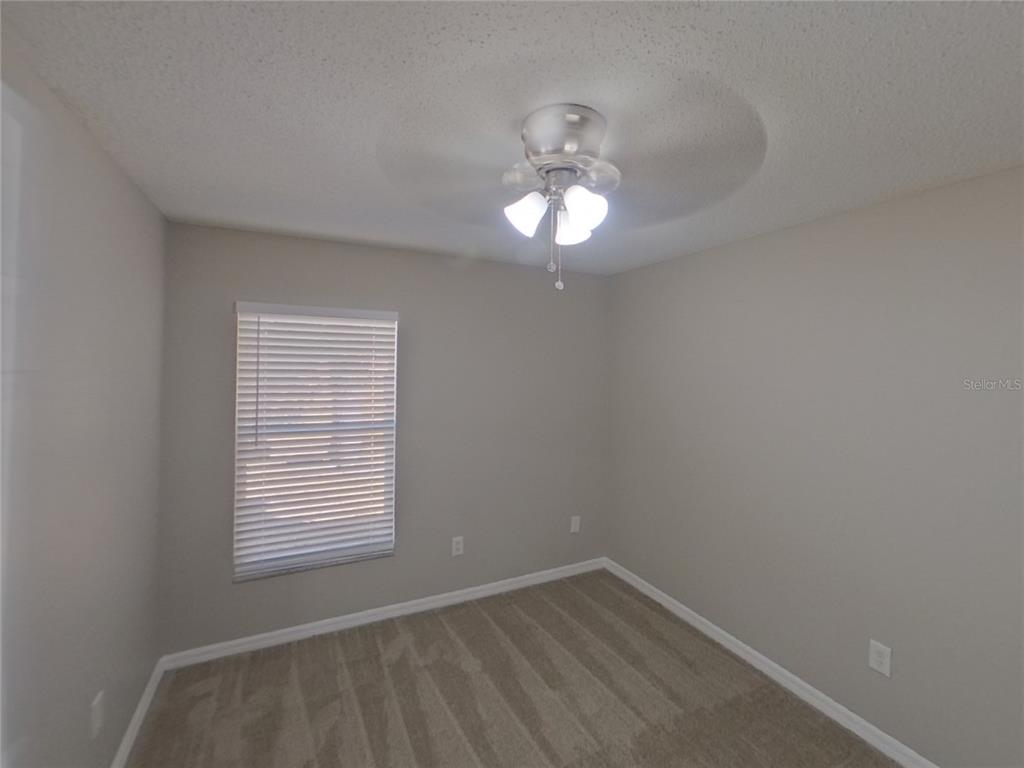 Undisclosed Address Riverview, FL 33578 - Photo 12 of 15 an empty room with a window