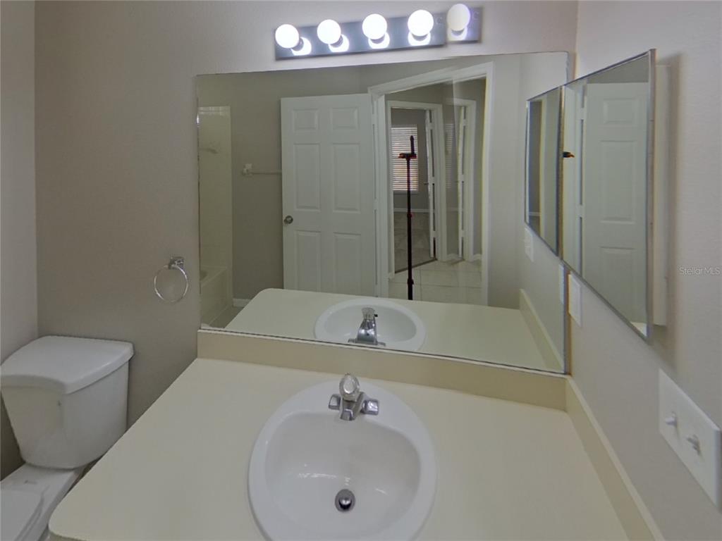 Undisclosed Address Riverview, FL 33578 - Photo 13 of 15 a bathroom with a sink a toilet and shower