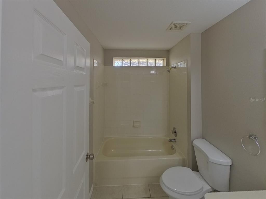 Undisclosed Address Riverview, FL 33578 - Photo 14 of 15 a bathroom with a toilet sink and bathtub