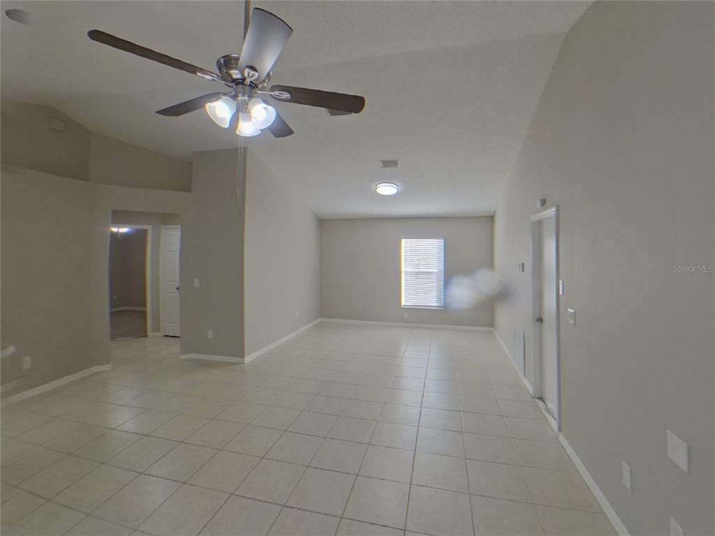 Undisclosed Address Riverview, FL 33578 - Photo 2 of 15 an empty room with fan and entrance