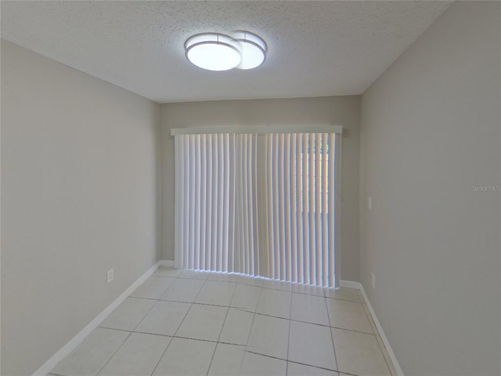 Undisclosed Address Riverview, FL 33578 - Photo 4 of 15 a view of an empty room with a window