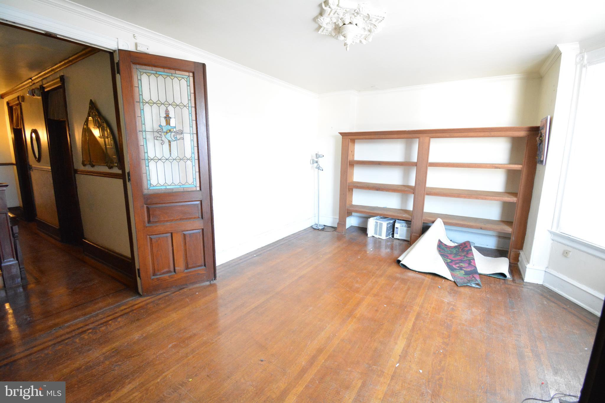 a bed room with a bed and a window