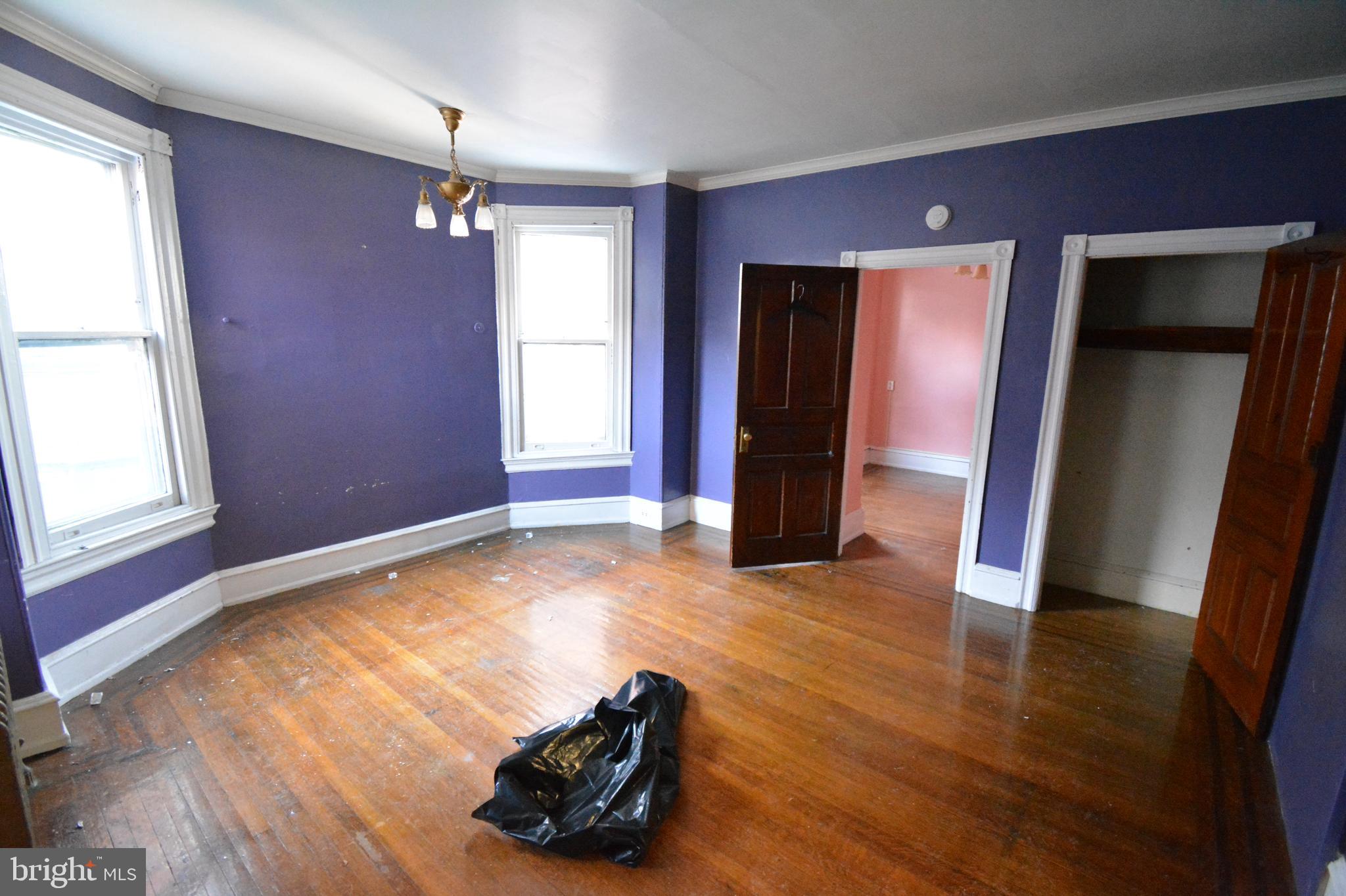 102 Manheim Street, Unit 2 Philadelphia, PA 19144 - Photo 5 of 13 a view of empty room with window and wooden floor