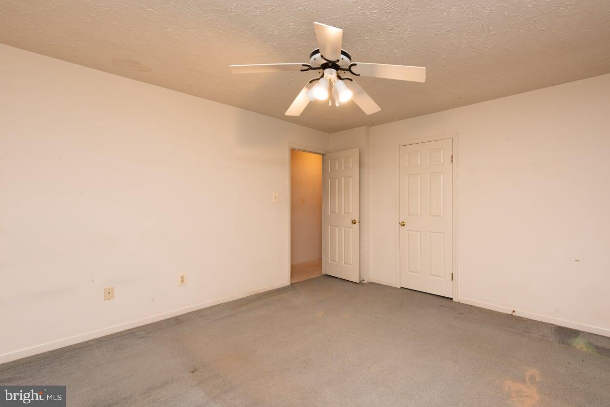 2216 Halter Lane Reston, VA 20191 - Photo 12 of 23 an empty room with a fan and a fan