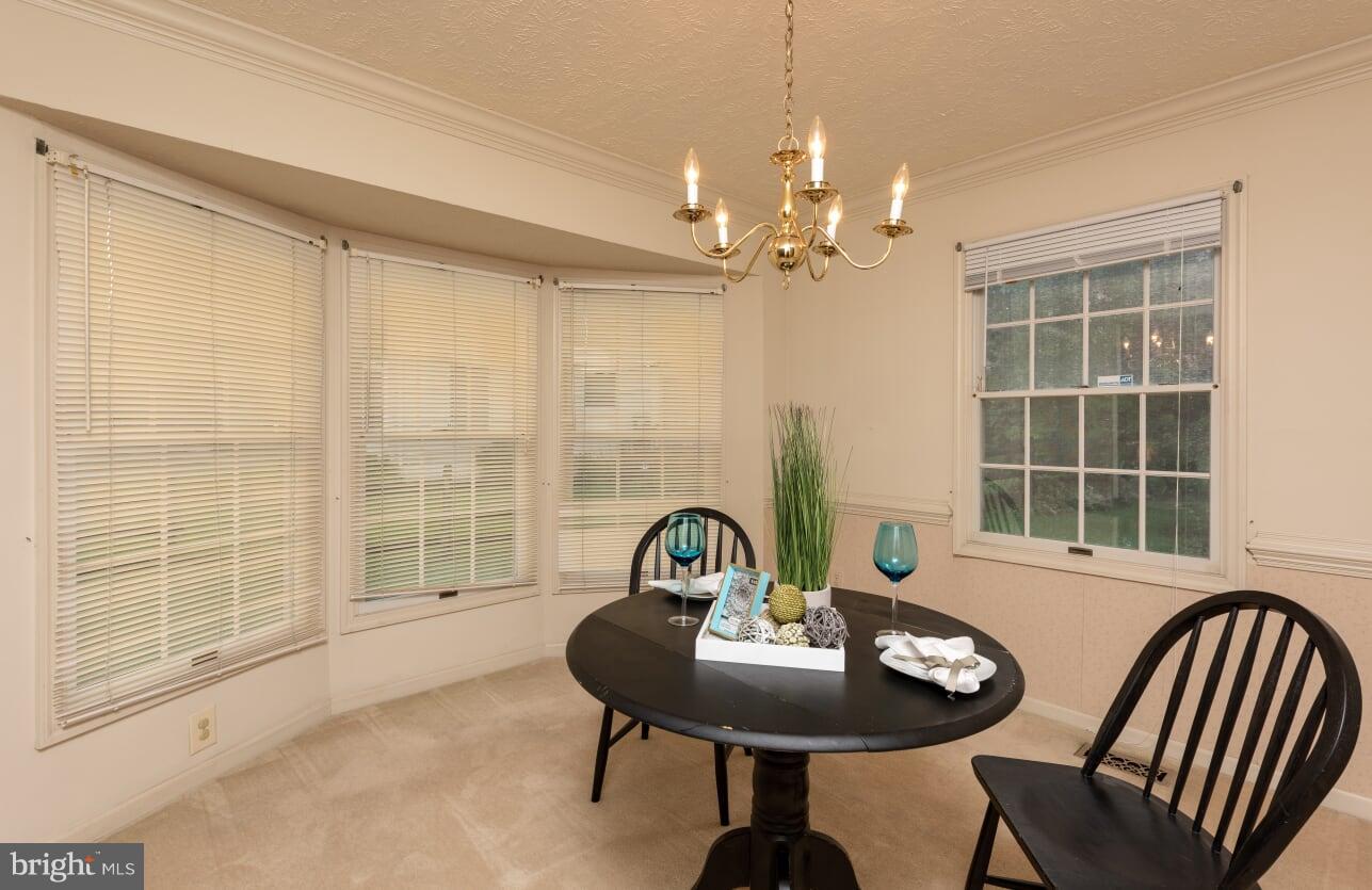 2216 Halter Lane Reston, VA 20191 - Photo 4 of 23 a view of a dining room with furniture window and outside view