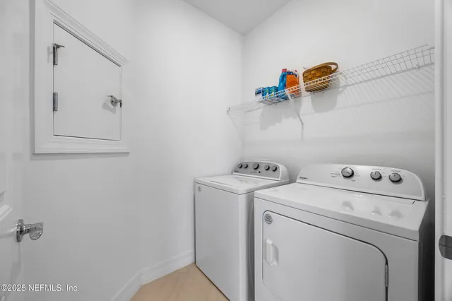 a view of a house with swimming pool and sitting area